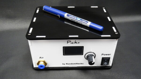Image of Pick+ station with a pen on top for scale